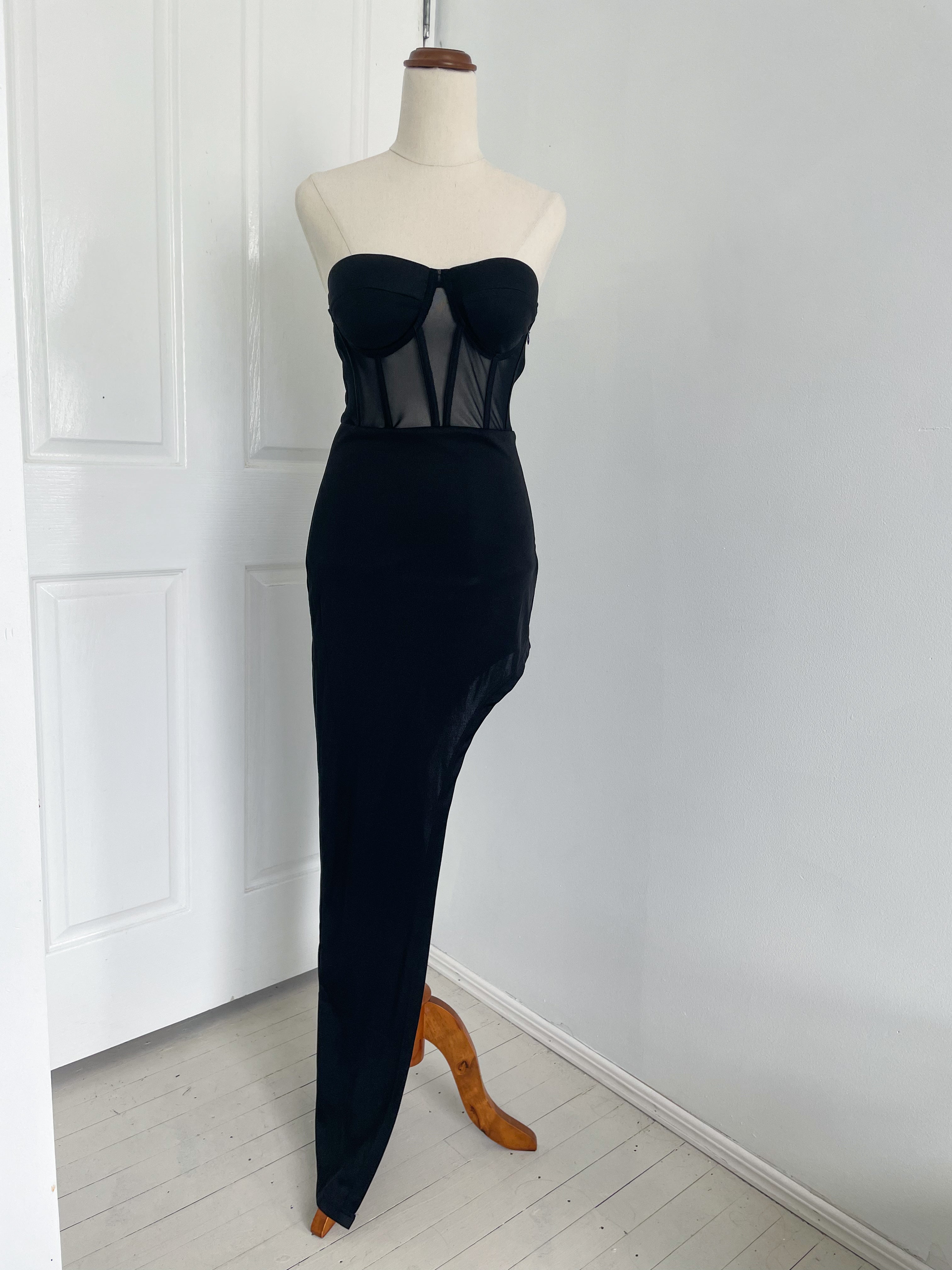a strapless corset black dress with a high side slit. a
