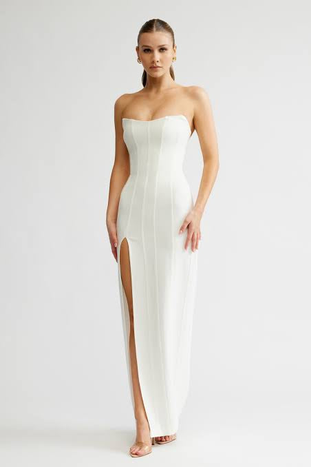 white strapless boned formal gown. floor length dress with thigh high split and boned structure