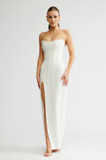 white strapless boned formal gown. floor length dress with thigh high split and boned structure