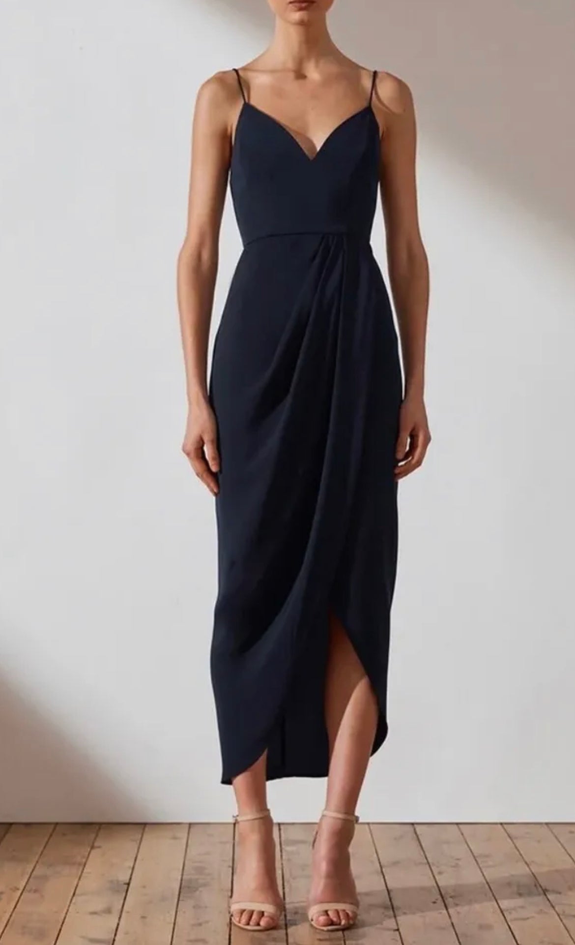 navy blue midi dress by shona joy. deep v neck with a draping flowy front. 