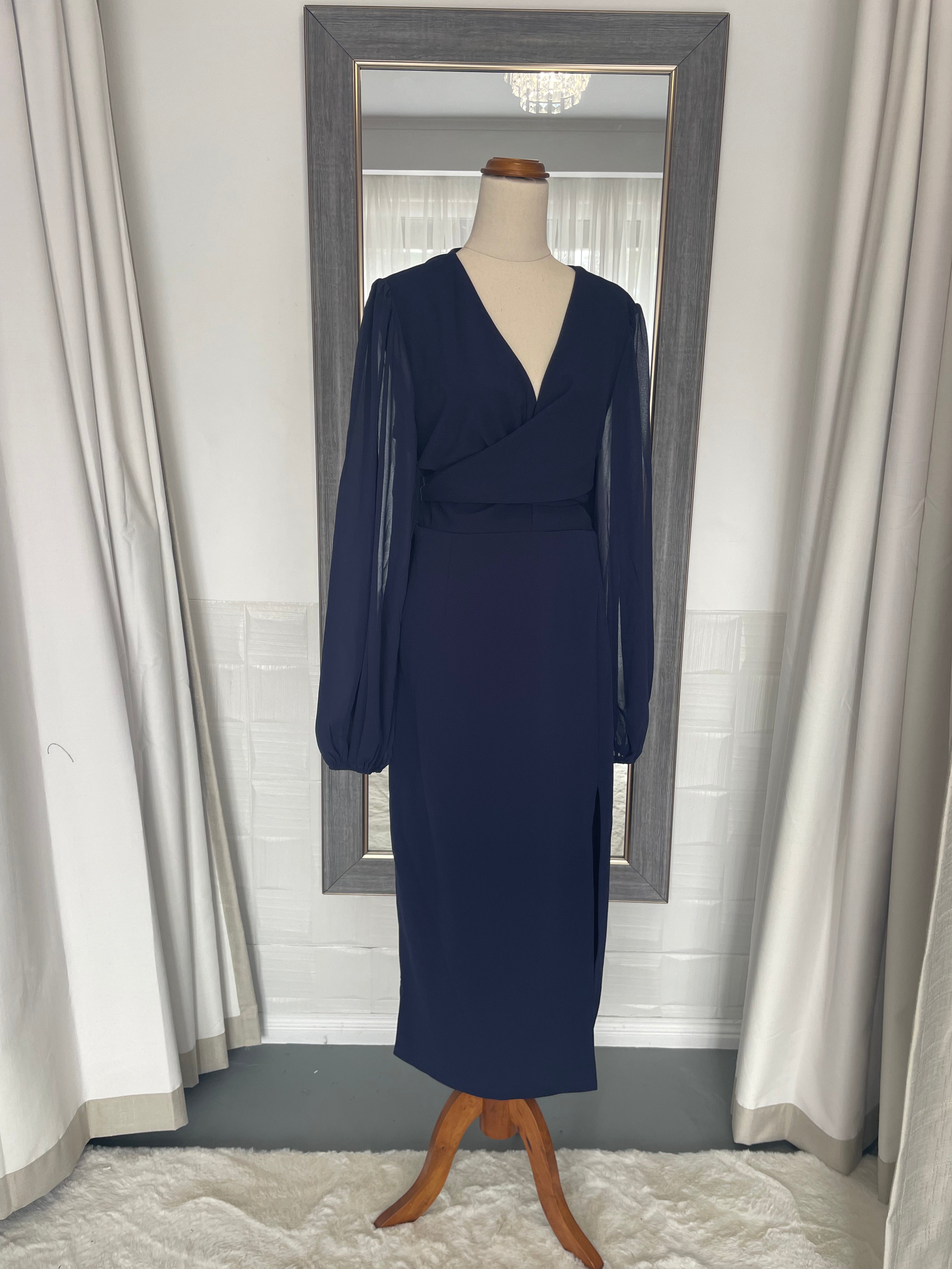 Plus size royal blue midi dress with sheer arms and a wrap around waist