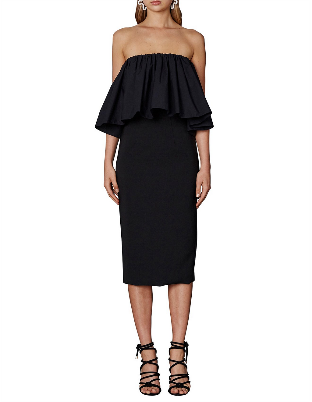 Black strapless dress with ruffled top worn by a model on a white background