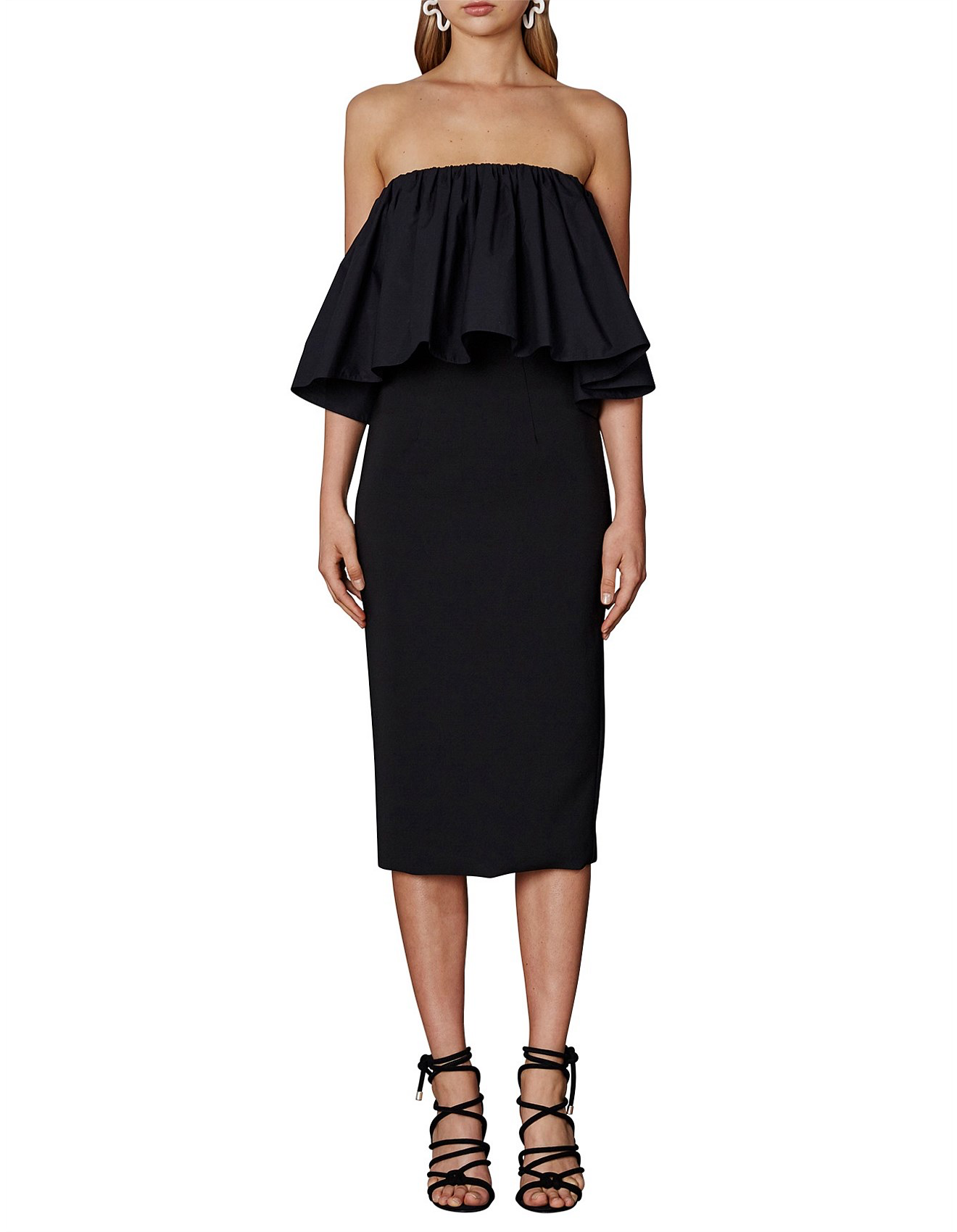 Black strapless dress with ruffled top worn by a model on a white background