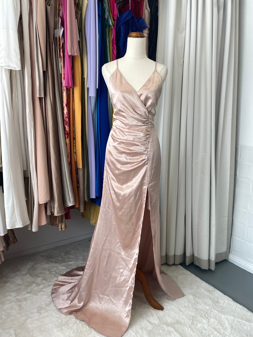 This gorgeous rose gold maxi dress strikes the perfect balance between polished and fun, with chic side ruching that hugs you in all the right ways. A bold high leg split keeps things interesting with a dash of modern edge, while the flowing drape works its magic to elongate and flatter your frame beautifully.