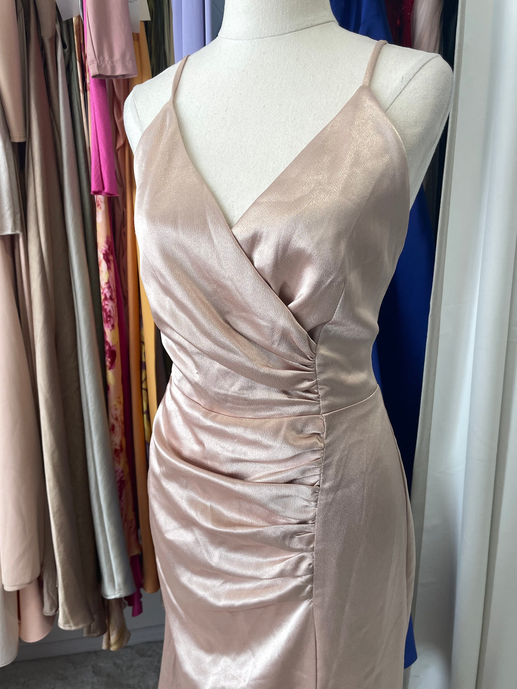 Satin dress featuring wrap around bust and ruched gathered front 