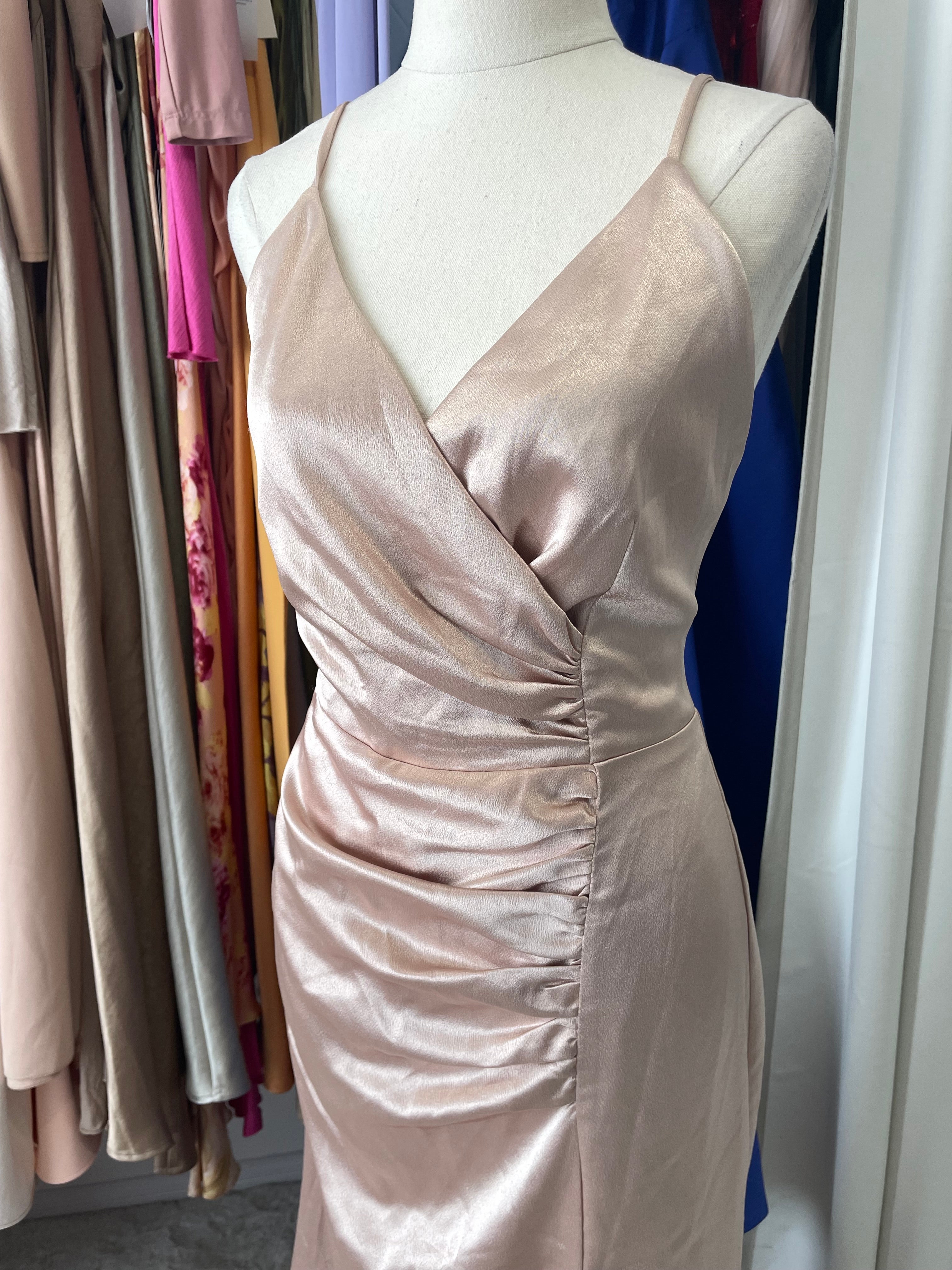 Satin dress featuring wrap around bust and ruched gathered front 