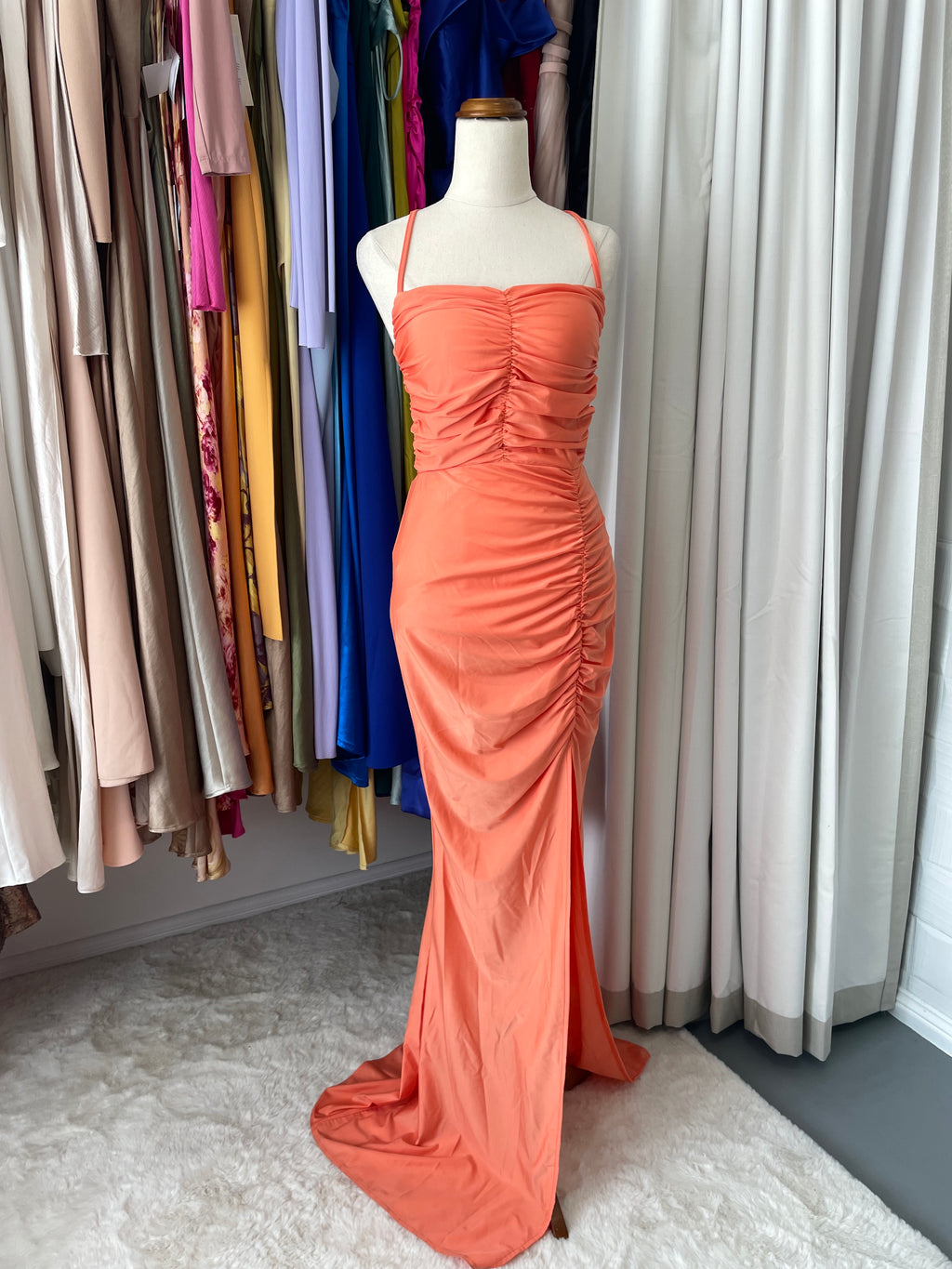Miss Ord Ruched coral gathered gown with leg split and halter neck tie 

