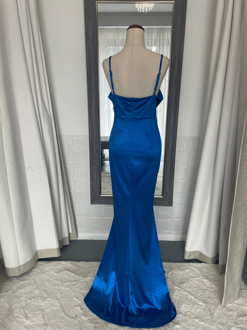back of royal blue formal gown, floor length dress and a draping cowl neck. 