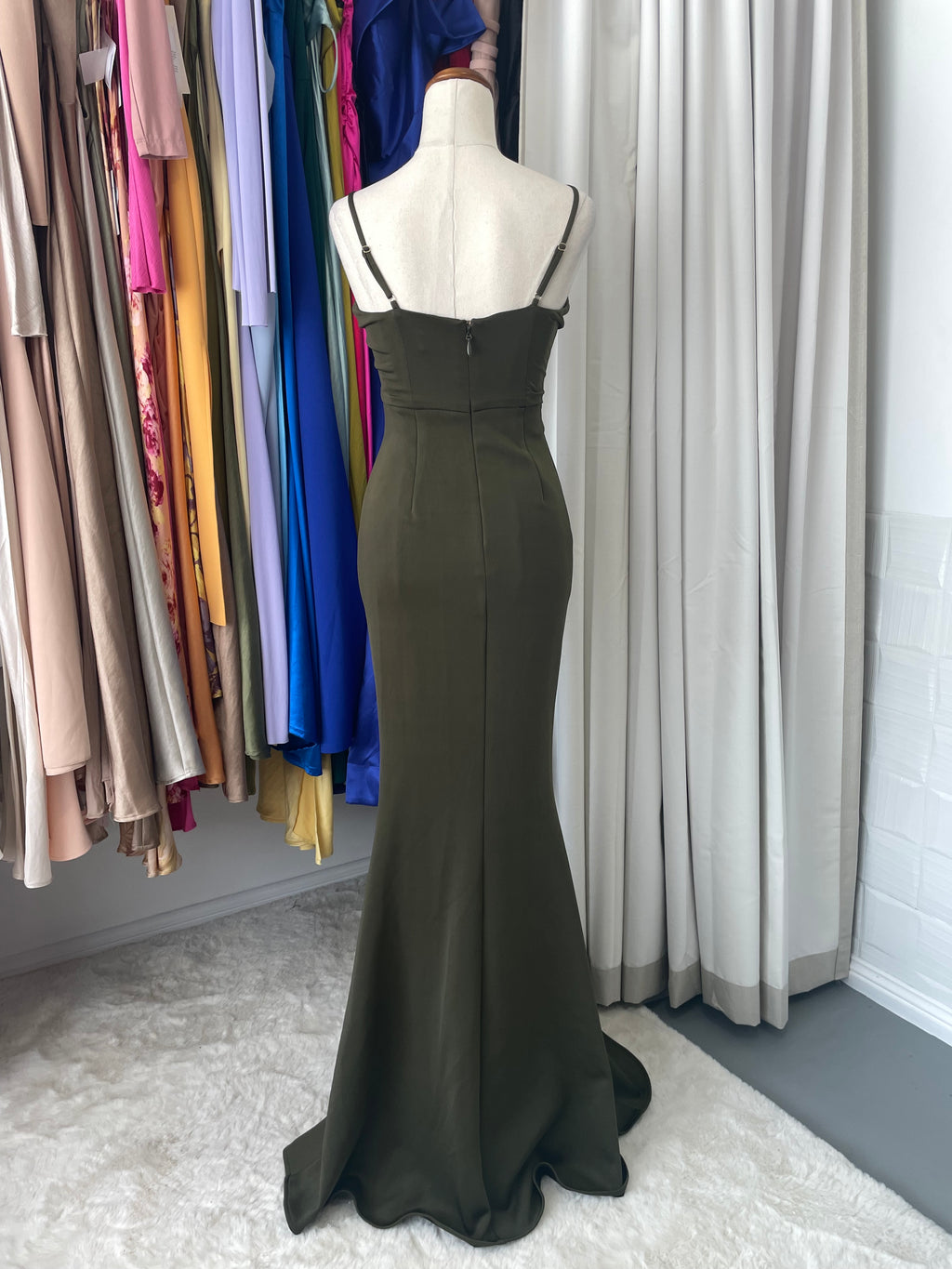 This Sheike piece delivers understated edge with practical style. Customizable straps and a concealed back zipper offer versatility, while the stretchy fabric moves with your body. The standout waist detailing creates dimension and shape, enhanced by a subtle mermaid hem that adds just enough curve without overdoing it.