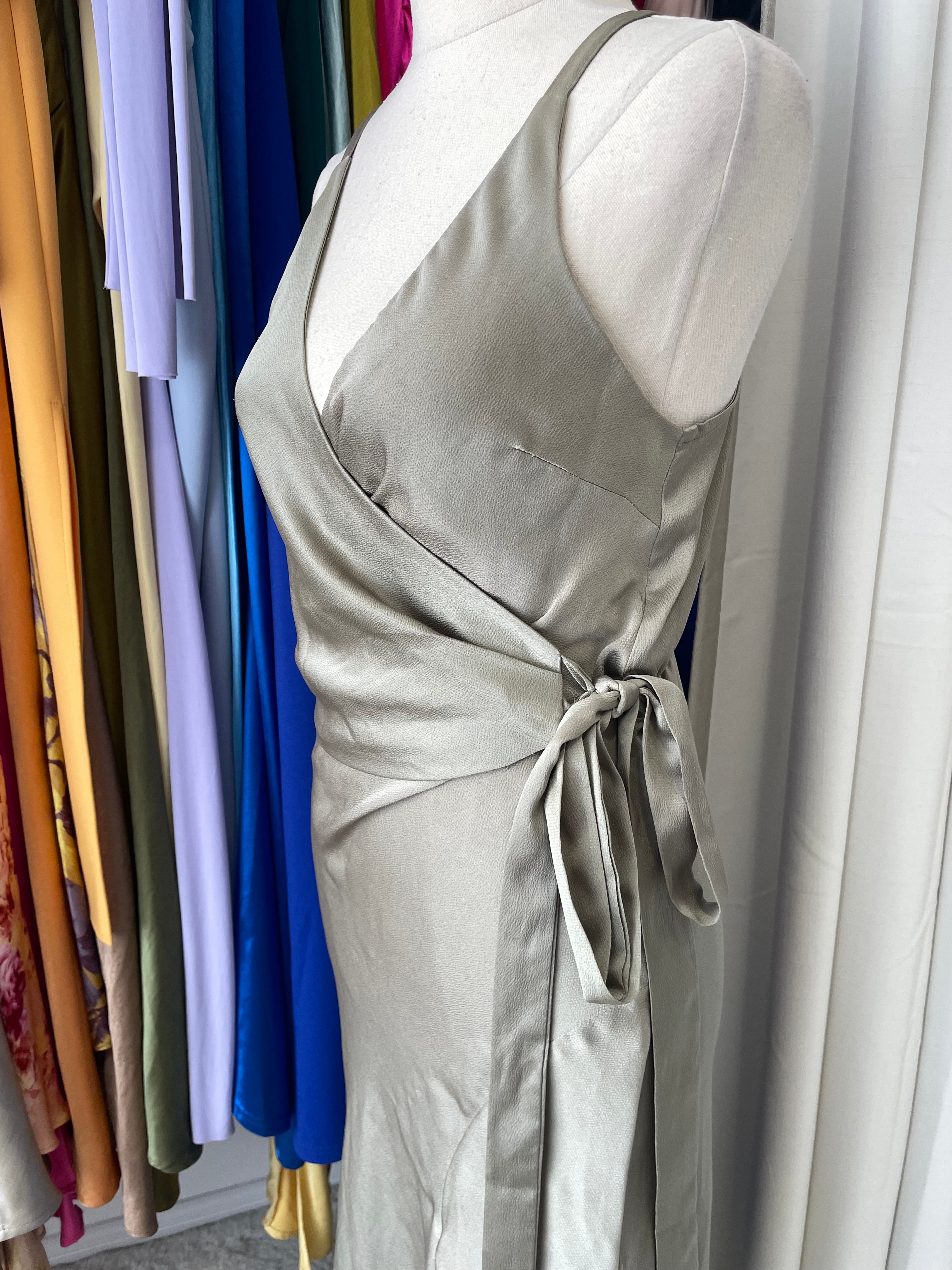 Gray dress with a bow on a colorful background