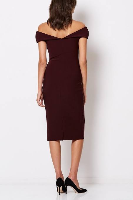 Model wearing a burgundy off-shoulder dress on a white background.