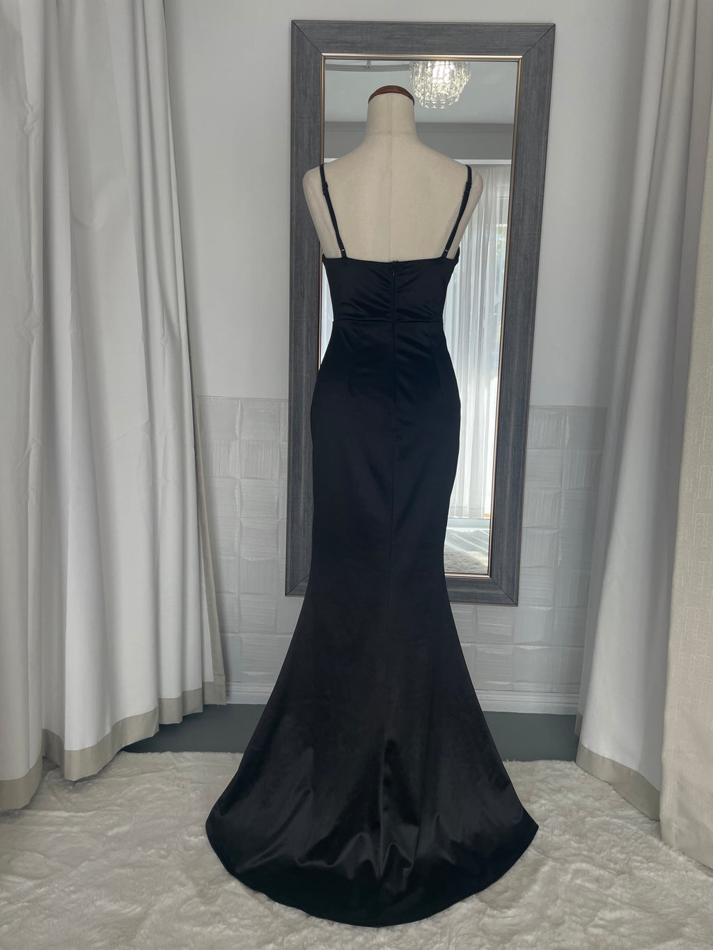 back of Black satin floor length gown with a draping cowl neck 