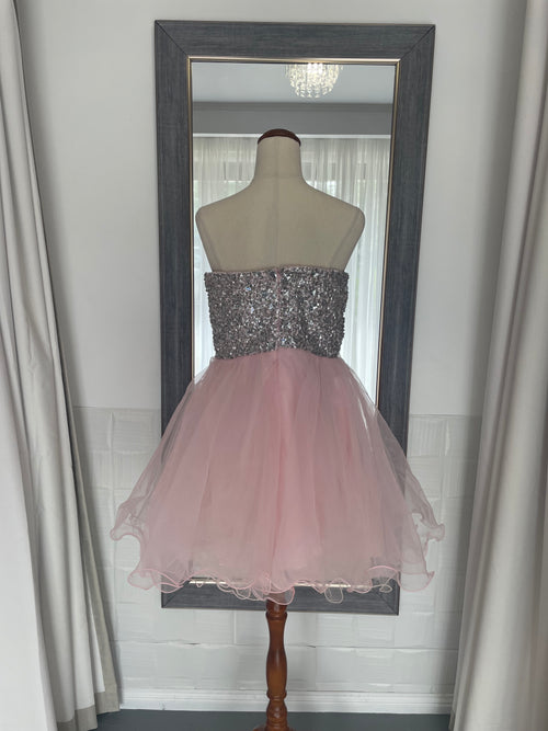 back of Pink mini dress with tulle skirt and diamante crystal sequin bust